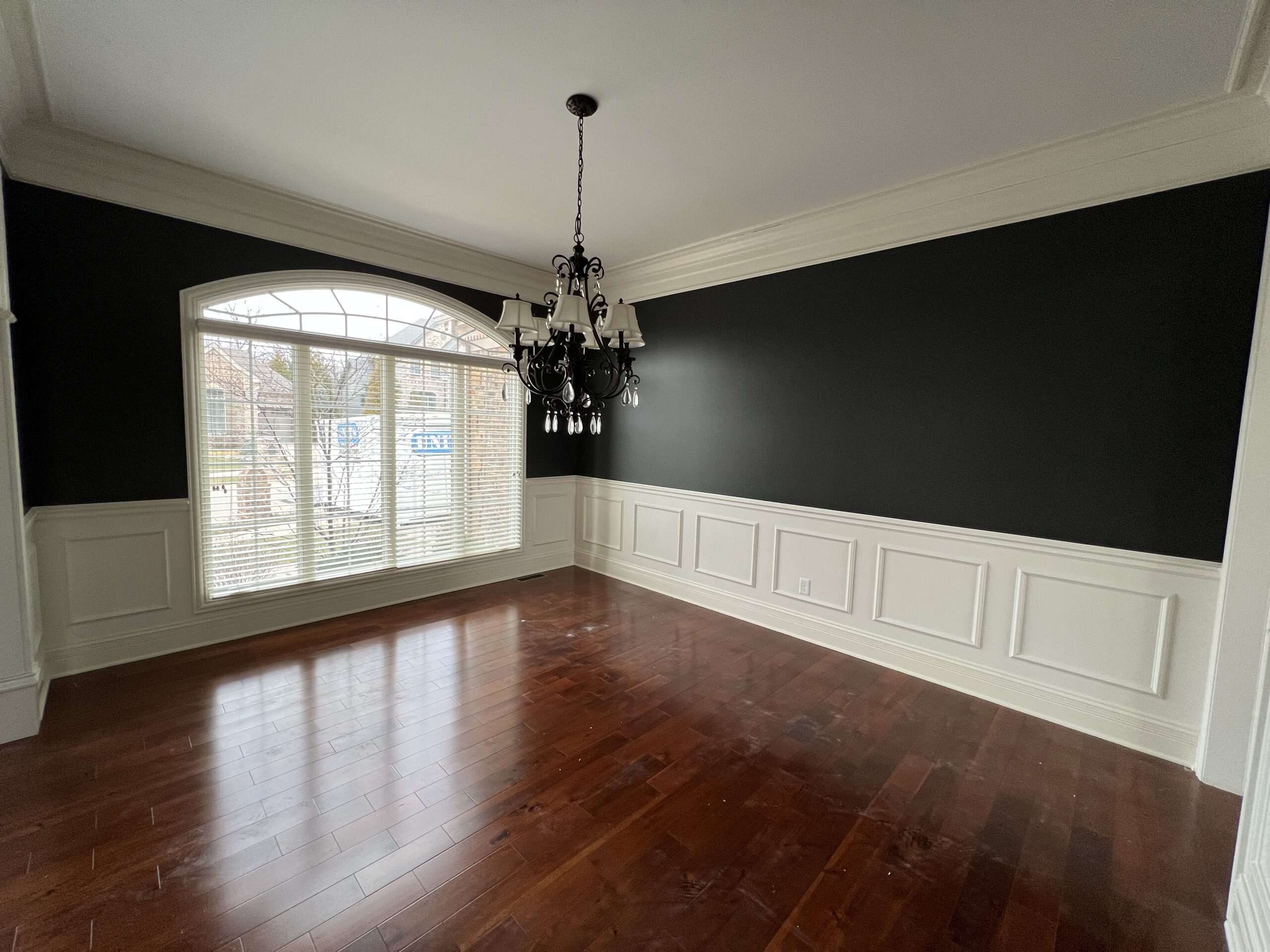 This is a dining room painted tricorn black from an older yellow color.