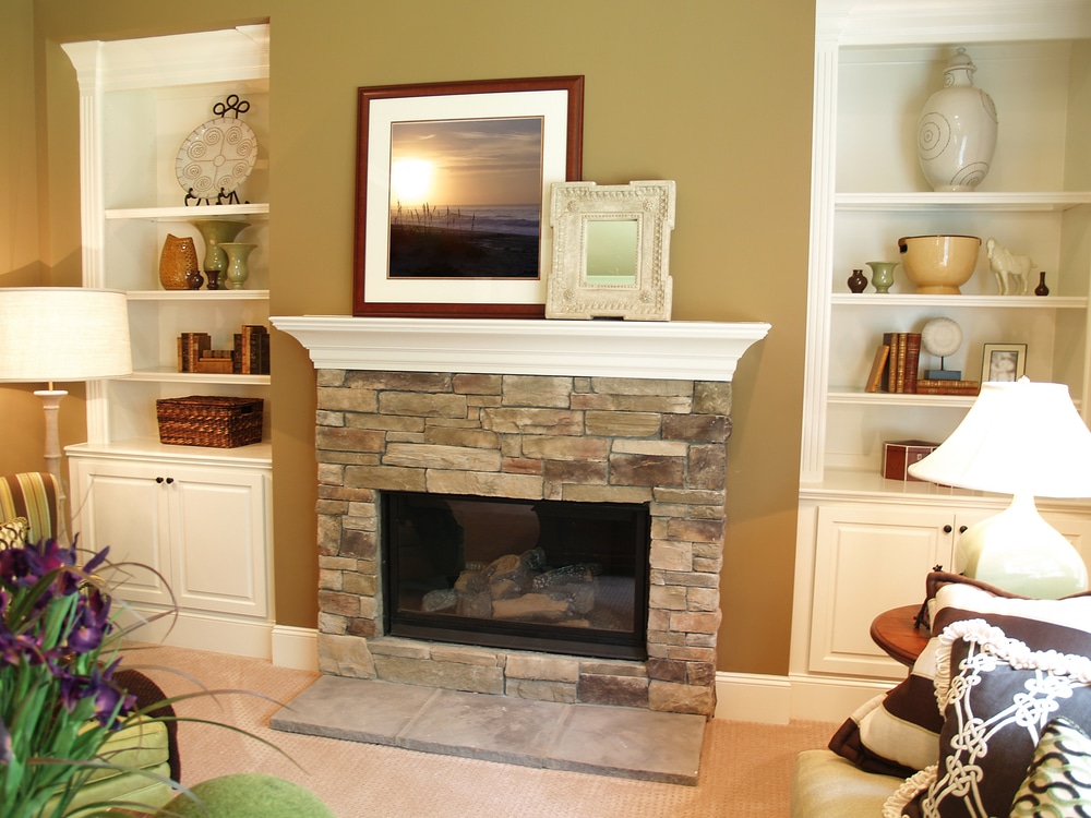 Built-in storage surrounding fireplace gets fresh coat of paint